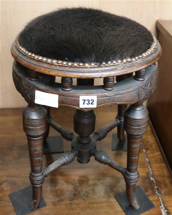 A late Victorian walnut music stool, 44cm high